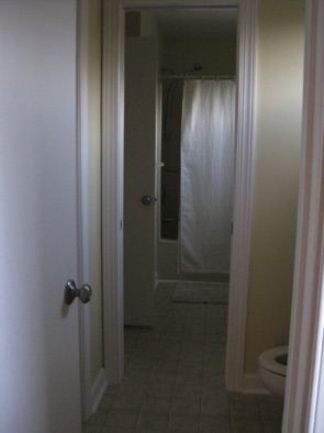 Looking through to shower/tub and 2nd sink on right Looking through to shower/tub and 2nd sink on right